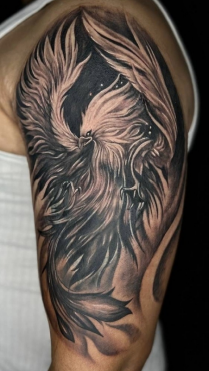 Cover-up tattoo designs for men on upper arm by Inkaura Tattoos in Pune.
