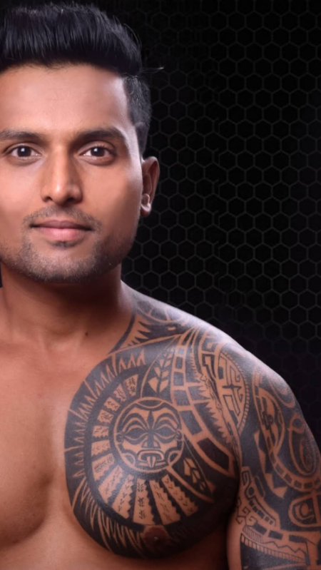 Polynesian tribal tattoo designs for men covering the chest and shoulder, expertly inked by Inkaura Tattoos