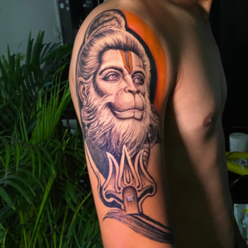 Hanuman tattoo designs for men on upper arm by Inkaura Tattoos in Pune.