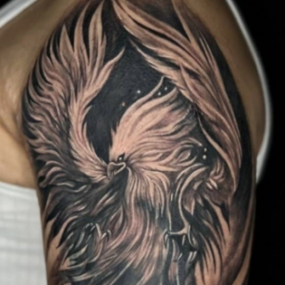 Cover-up tattoo designs for men on upper arm by Inkaura Tattoos in Pune.